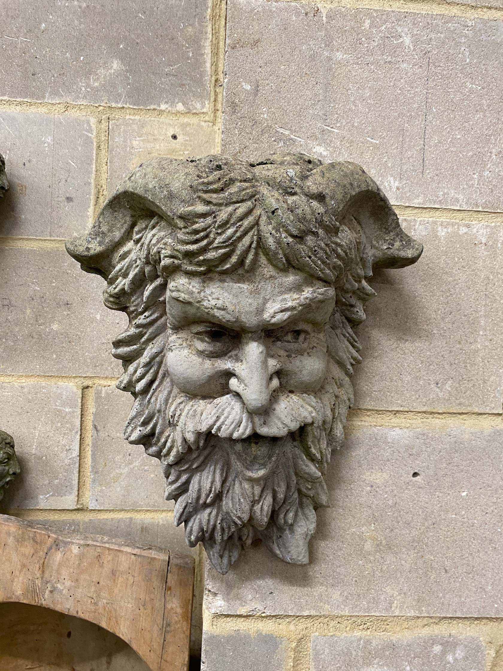 A reconstituted stone garden wall mask, height 40cm